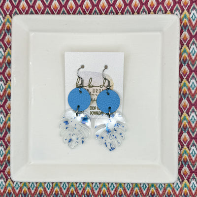 ACRYLIC PALM COLLECTION: MONSTERA PALM-  Leather Earrings  ||  <BR>  CAROLINA BLUE, <BR> CLEAR WITH BLUE FLAKES MONSTERA LEAF