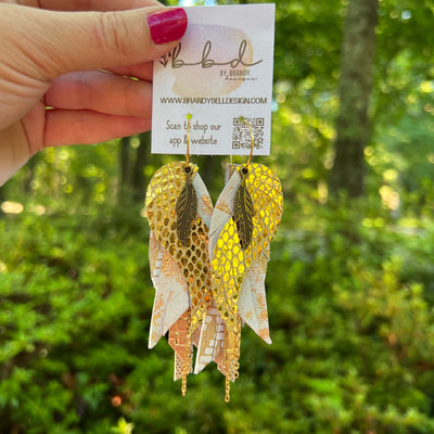 ROXY -  Leather Earrings  ||   <BR> FEATHER CHARM, <BR> METALLIC GOLD SCALES, <BR> GOLD AND WHITE NORTHERN LIGHTS, <BR> GOLD CHEVRON, <BR> METALLIC GOLD PANAMA WEAVE, <BR> METALLIC GOLD DOTS