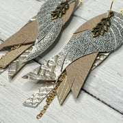 ROXY -  Leather Earrings  ||   <BR> LEAF CHARM, <BR> METALLIC CHAMPAGNE CRACKLE, <BR> DISTRESSED IVORY, <BR> METALLIC CHAMPAGNE PANAMA WEAVE, <BR> CHAMPAGNE CHINESE FANS, <BR> METALLIC CHAMPAGNE COBRA