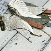 ROXY -  Leather Earrings  ||   <BR> FEATHER CHARM, <BR> METALLIC CHAMPAGNE SMOOTH, <BR> BOHO DASHES, <BR> PEARLIZED OLIVE GREEN, <BR> PEACH PALMS, <BR> DUSTY AQUA BRAID