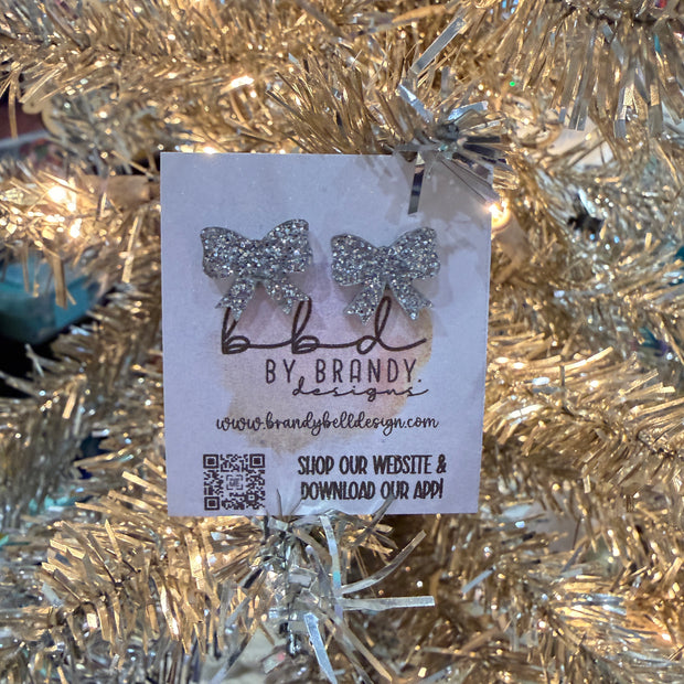 ACRYLIC EARRINGS by Brandy. Designs || BOW STUDS (SILVER GLITTER)