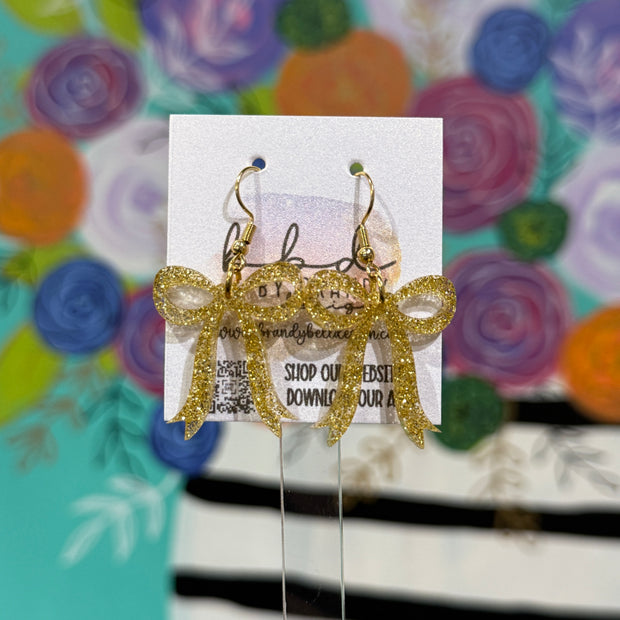 ACRYLIC EARRINGS by Brandy. Designs || KNOTTED BOW (GOLD GLITTER)