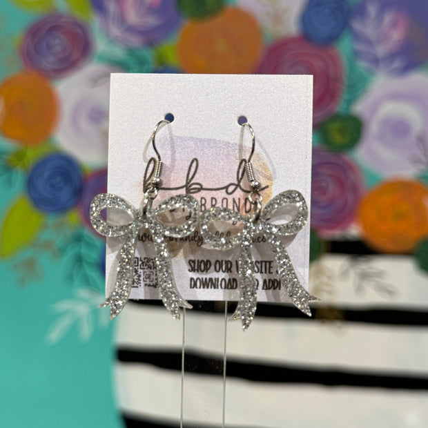 ACRYLIC EARRINGS by Brandy. Designs || KNOTTED BOW (SILVER GLITTER)