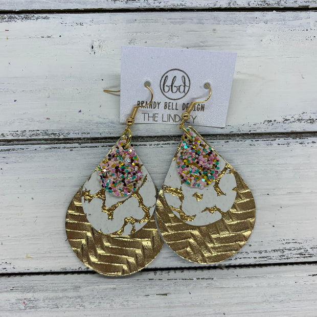 LINDSEY - Leather Earrings  ||   <BR>  BANANA SPLIT GLITTER (FAUX LEATHER), <BR> WHITE WITH GOLD ACCENTS,  <BR> METALLIC GOLD BRAIDED