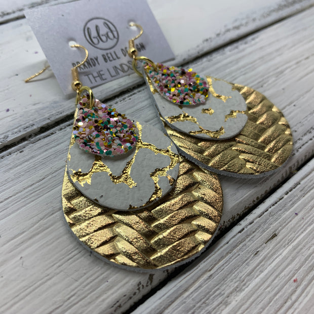 LINDSEY - Leather Earrings  ||   <BR>  BANANA SPLIT GLITTER (FAUX LEATHER), <BR> WHITE WITH GOLD ACCENTS,  <BR> METALLIC GOLD BRAIDED