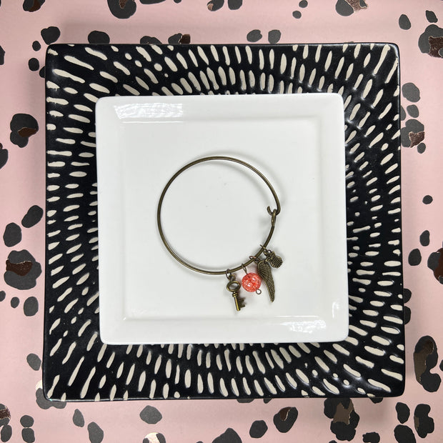 BANGLE BRACELET  || BRONZE <BR> RED/ORANGE BEAD WITH KEY, FEATHER & OWL