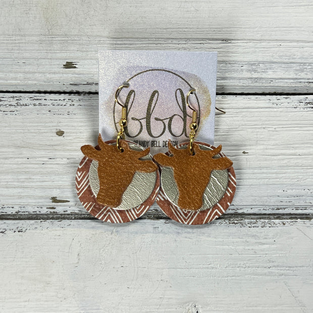 COW -  Leather Earrings  ||   <BR> PEARLIZED TOPAZ, <BR> METALLIC CHAMPAGNE SMOOTH, <BR> MUDCLOTH