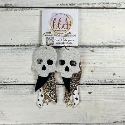 FANCY SKULL -  Leather Earrings  ||   <BR> WHITE FINE GLITTER (LEATHER ON THICK CORK), METALLIC BLACK SMOOTH, METALLIC ROSE GOLD PEBBLED, ROSE GOLD POLKADOTS ON WHITE